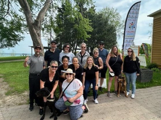 Employees and family from DKI-CRCS stand together for a photo along with CEO of Their Opportunity before GOCC's 5km charity walk along the Oshawa waterfront.